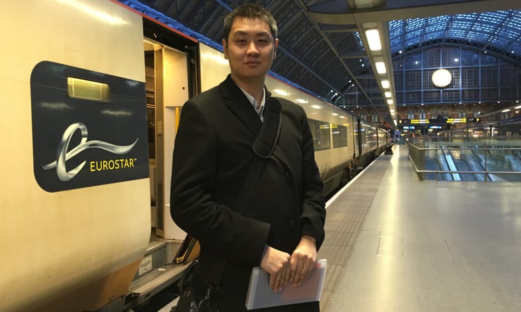 David Feng next to a Eurostar train