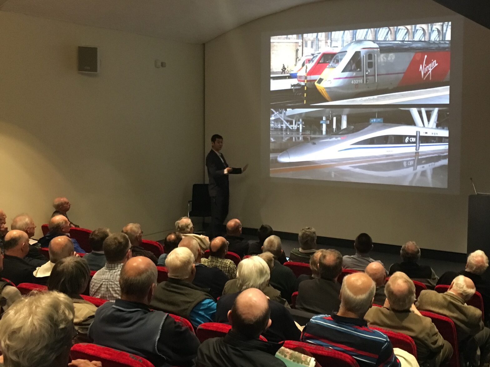 An image of David Feng presenting a railway talk in London
