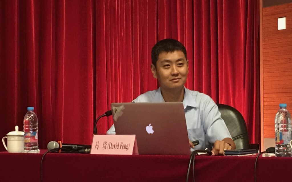 A picture of David Feng about to give a presentation in China