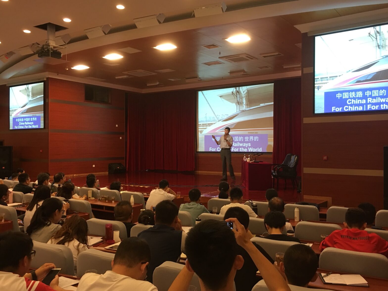 A picture of David Feng speaking to rail PR crew in China